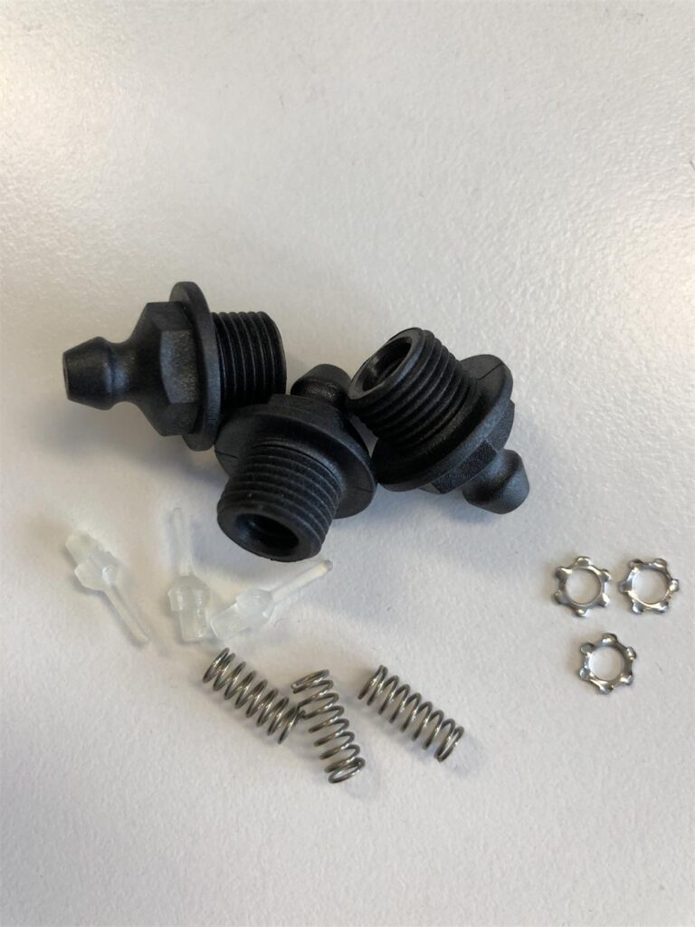plastic injection molded assembly with spring