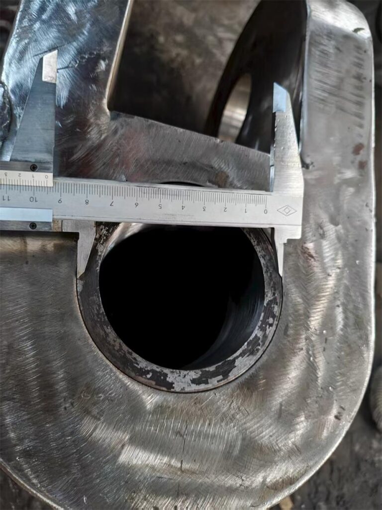 Close-up measuring welded seam and component size