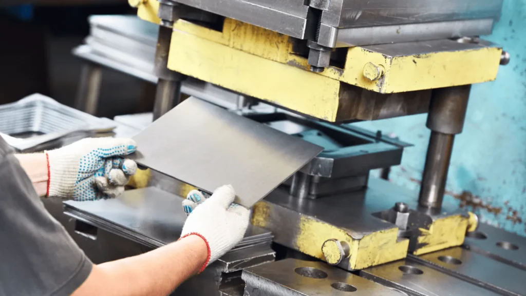 Metal stamping process using sheet metal press for high-volume industrial parts manufacturing