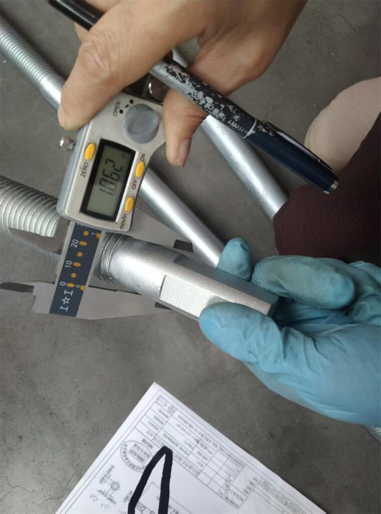 Right end diameter inspection of machined adjusting spindle