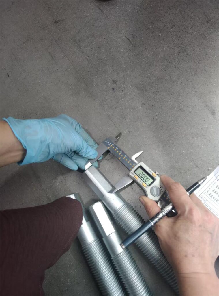 Slot length inspection on machined end of adjusting spindle