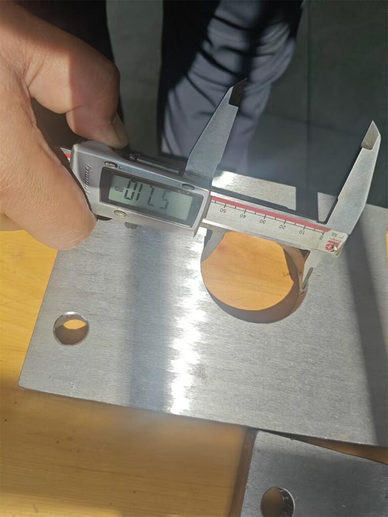 Large hole diameter inspection of steel guide plate