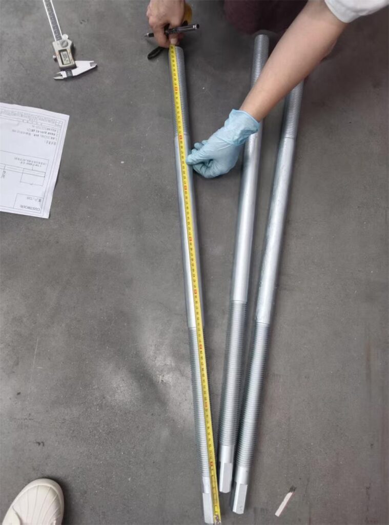 Overall length inspection of custom threaded adjusting spindle