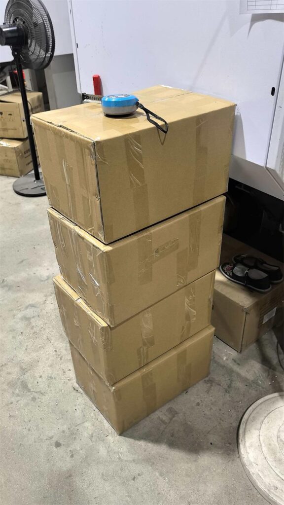 Four cartons of ABS plastic nozzles prepared for air shipment to Israel