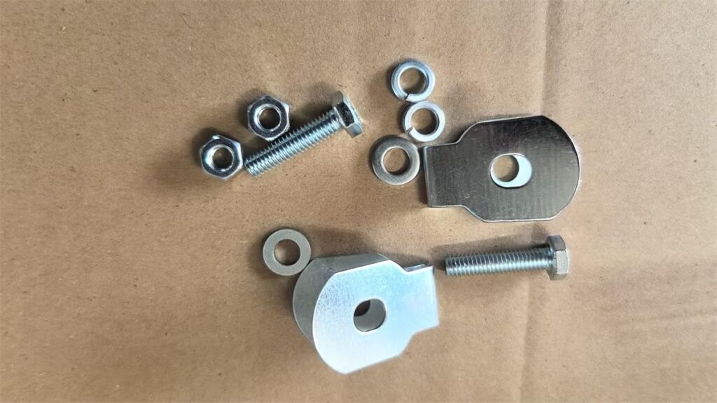 Stamped cable tab with bolt nut flat washers and spring washers