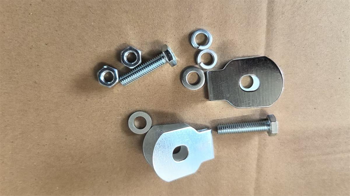 Stamped cable tab with bolt nut flat washers and spring washers