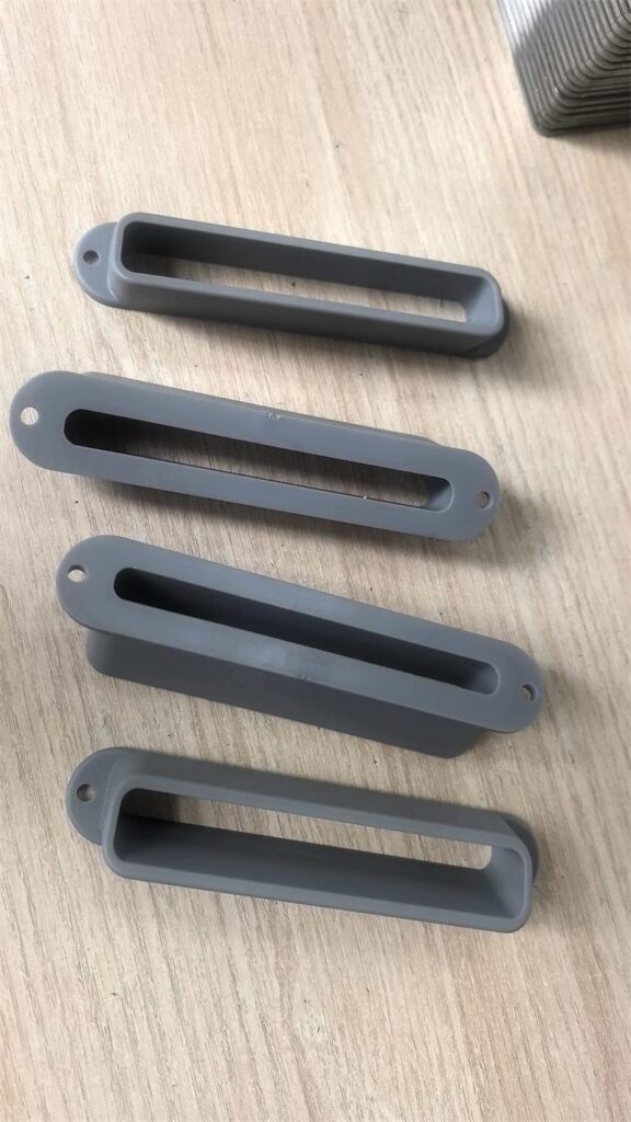 RAL 7042 gray ABS plastic nozzle batch samples after injection molding