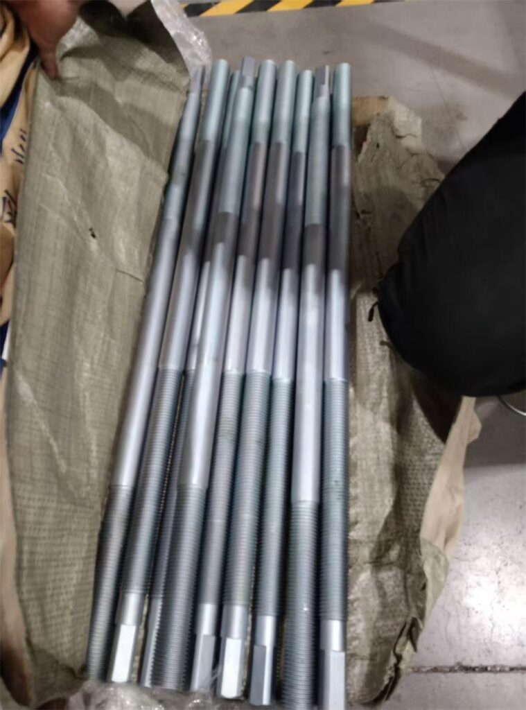 CNC machined alloy steel threaded spindles with machined flats and zinc plating