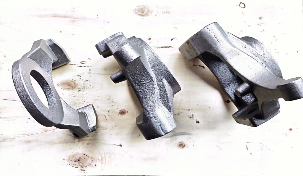 Matching ductile iron knuckle and brake bracket castings for automotive aftermarket use